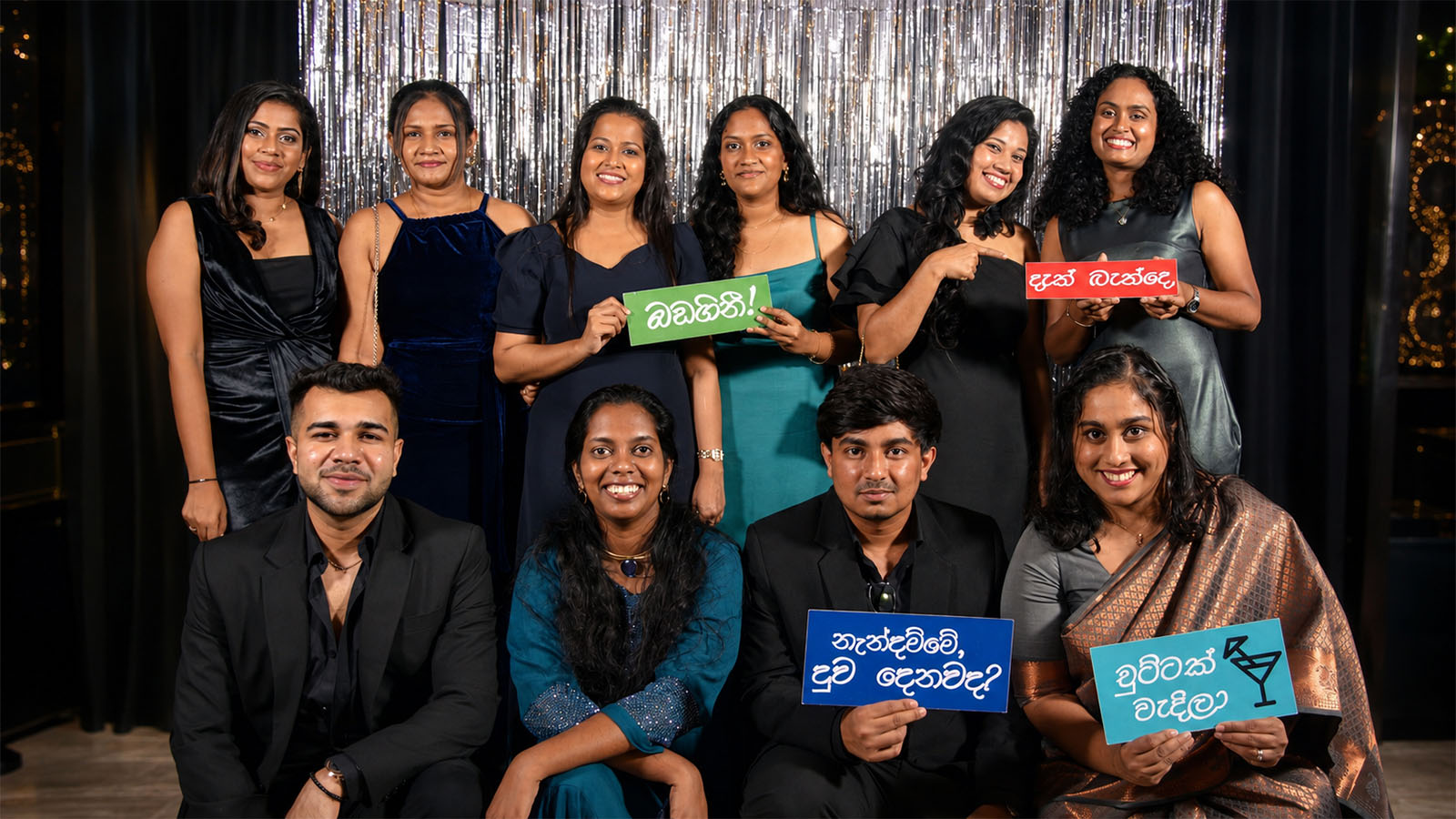 Wedding guests posing with photobooth signs